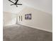 Carpeted bedroom featuring a vaulted ceiling, ceiling fan, and natural light at 9025 Huntwood Ln, Riverdale, GA 30274