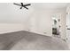Carpeted bedroom with vaulted ceiling features ensuite bathroom and neutral decor at 9025 Huntwood Ln, Riverdale, GA 30274