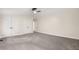 Spacious carpeted bedroom with vaulted ceiling features a ceiling fan and double closets at 9025 Huntwood Ln, Riverdale, GA 30274