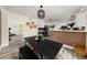 Open concept kitchen and dining area with modern lighting and decor at 9025 Huntwood Ln, Riverdale, GA 30274