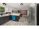 Spacious kitchen with modern finishes, stainless steel appliances and an eat-in dining area at 9025 Huntwood Ln, Riverdale, GA 30274