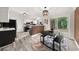 Open kitchen with modern appliances, and sliding door to outdoor living space at 9025 Huntwood Ln, Riverdale, GA 30274