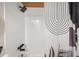 Shower featuring white tile, dark fixtures, wood ceiling and modern shower curtain at 9025 Huntwood Ln, Riverdale, GA 30274