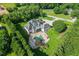 Luxury home showcasing a gorgeous backyard pool and spa with stone patio, lush landscaping, and a well-manicured lawn at 2871 Hosch Valley Rd, Buford, GA 30519
