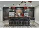 Finished bar area with seating, modern lighting, stainless steel appliances, and stylish cabinets at 2871 Hosch Valley Rd, Buford, GA 30519