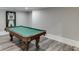 Inviting game room showcasing a classic pool table with stylish flooring and neutral wall paint at 2871 Hosch Valley Rd, Buford, GA 30519