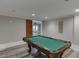 Spacious game room featuring a traditional pool table, plank flooring, and modern lighting at 2871 Hosch Valley Rd, Buford, GA 30519
