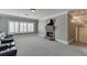 Home theater view featuring a stone fireplace, a flat screen TV, and comfortable seating at 2871 Hosch Valley Rd, Buford, GA 30519
