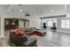 Entertainment room with bar, home theater projector, and large comfortable sectional seating at 2871 Hosch Valley Rd, Buford, GA 30519