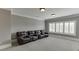 Spacious home theater room featuring plush leather reclining seating and neutral decor at 2871 Hosch Valley Rd, Buford, GA 30519