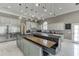 Bright kitchen featuring a built-in dining booth, stainless steel appliances, and modern fixtures at 2871 Hosch Valley Rd, Buford, GA 30519