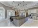 Spacious kitchen with center island, booth seating, stainless steel appliances, and ample cabinet space at 2871 Hosch Valley Rd, Buford, GA 30519