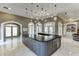 Gourmet kitchen featuring a large island with seating, custom cabinetry, and an open layout at 2871 Hosch Valley Rd, Buford, GA 30519