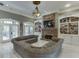 Comfortable living room features a stone fireplace, built-in shelving, and a large sectional sofa at 2871 Hosch Valley Rd, Buford, GA 30519