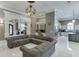 Spacious living room with open design, stone fireplace, and access to kitchen and dining areas at 2871 Hosch Valley Rd, Buford, GA 30519