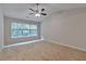 Vaulted ceiling bedroom features a ceiling fan, plush carpet, and natural light at 3686 Claredun Ct, Cumming, GA 30040