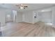 Spacious living room featuring wood floors, an open layout, and plenty of natural light at 3686 Claredun Ct, Cumming, GA 30040