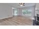 Cozy living room with wood floors, a fireplace, and access to the backyard at 3686 Claredun Ct, Cumming, GA 30040