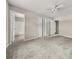 Bedroom featuring plush carpet and bathroom access at 5058 Rock Springs Rd, Lithonia, GA 30038