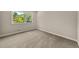 Bedroom with carpet, window and good natural light at 5058 Rock Springs Rd, Lithonia, GA 30038