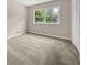 Bright bedroom with plush carpet and natural light at 5058 Rock Springs Rd, Lithonia, GA 30038