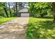 Long driveway leading to the two-car garage of this charming home at 5058 Rock Springs Rd, Lithonia, GA 30038