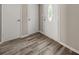 Inviting foyer with modern wood-look floors and neutral paint colors at 5058 Rock Springs Rd, Lithonia, GA 30038