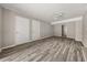 Open-concept living room with wood-look floors and ample natural light at 5058 Rock Springs Rd, Lithonia, GA 30038