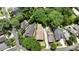 An aerial view showcasing the home's location within a well-treed residential neighborhood with nearby amenities at 1363 Sylvan Ne Cir, Brookhaven, GA 30319