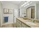 Well-lit bathroom with double vanity, framed mirrors, and tile flooring at 1363 Sylvan Ne Cir, Brookhaven, GA 30319