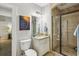 Elegant bathroom featuring a glass enclosed shower and modern vanity with ample lighting at 1363 Sylvan Ne Cir, Brookhaven, GA 30319