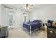 Bright bedroom featuring stylish bed frame, desk, and carpet flooring at 1363 Sylvan Ne Cir, Brookhaven, GA 30319