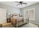Cozy bedroom with a comfortable bed, ceiling fan and shuttered windows offering natural light at 1363 Sylvan Ne Cir, Brookhaven, GA 30319