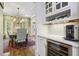 Convenient butler's pantry with wine storage, a beverage center, and easy access to the dining room at 1363 Sylvan Ne Cir, Brookhaven, GA 30319