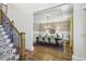Elegant dining room with decorative wallpaper, a modern chandelier, and seating for eight at 1363 Sylvan Ne Cir, Brookhaven, GA 30319