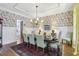 Well-appointed dining room with floral wallpaper and stylish decor, perfect for entertaining guests at 1363 Sylvan Ne Cir, Brookhaven, GA 30319