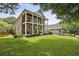 A charming two-story brick home with double porches and a well-manicured lawn at 1363 Sylvan Ne Cir, Brookhaven, GA 30319