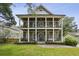 Charming two-story brick home featuring dual front porches with stately columns and manicured landscaping at 1363 Sylvan Ne Cir, Brookhaven, GA 30319