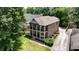 Two-story brick home featuring double porches, a long driveway, and a lush landscaped lawn at 1363 Sylvan Ne Cir, Brookhaven, GA 30319
