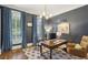 Bright and airy home office featuring large windows, a comfortable workspace, and natural light at 1363 Sylvan Ne Cir, Brookhaven, GA 30319