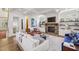 Bright living room with coffered ceilings, brick fireplace, built-in shelving, and large windows at 1363 Sylvan Ne Cir, Brookhaven, GA 30319