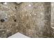 Tiled shower with dual shower heads, a built-in bench, and modern fixtures for a spa-like experience at 1363 Sylvan Ne Cir, Brookhaven, GA 30319