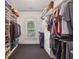 Organized walk-in closet featuring built-in shelves and rods for ample clothing and shoe storage at 1363 Sylvan Ne Cir, Brookhaven, GA 30319