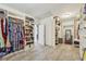 Spacious walk-in closet with custom shelving, ample storage, and unique flooring at 1363 Sylvan Ne Cir, Brookhaven, GA 30319