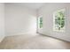 Neutral bedroom with multiple windows providing ample natural light at 4292 Hurt Bridge Rd, Cumming, GA 30028