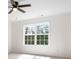 Bedroom showcasing a large window that fills the room with natural light at 4292 Hurt Bridge Rd, Cumming, GA 30028