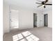 Spacious main bedroom with carpet, a ceiling fan, and multiple closets at 4292 Hurt Bridge Rd, Cumming, GA 30028