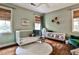 Light-filled Bedroom with light green walls and a hardwood floor at 55 Delmont Ne Dr # C3, Atlanta, GA 30305