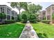 Manicured lawn and sidewalk between townhomes at 55 Delmont Ne Dr # C3, Atlanta, GA 30305