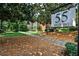Sign that says 55 Delmont with manicured landscape at 55 Delmont Ne Dr # C3, Atlanta, GA 30305